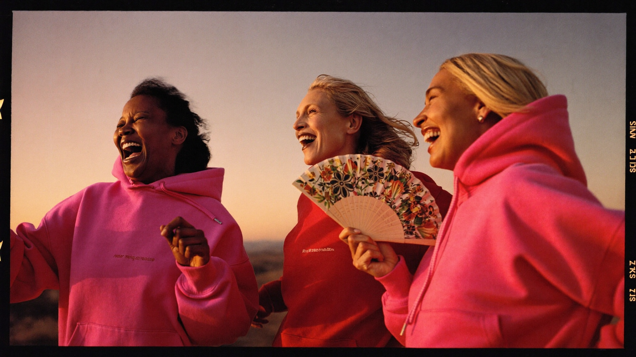 Women laughing in Little Miss Menopause merch